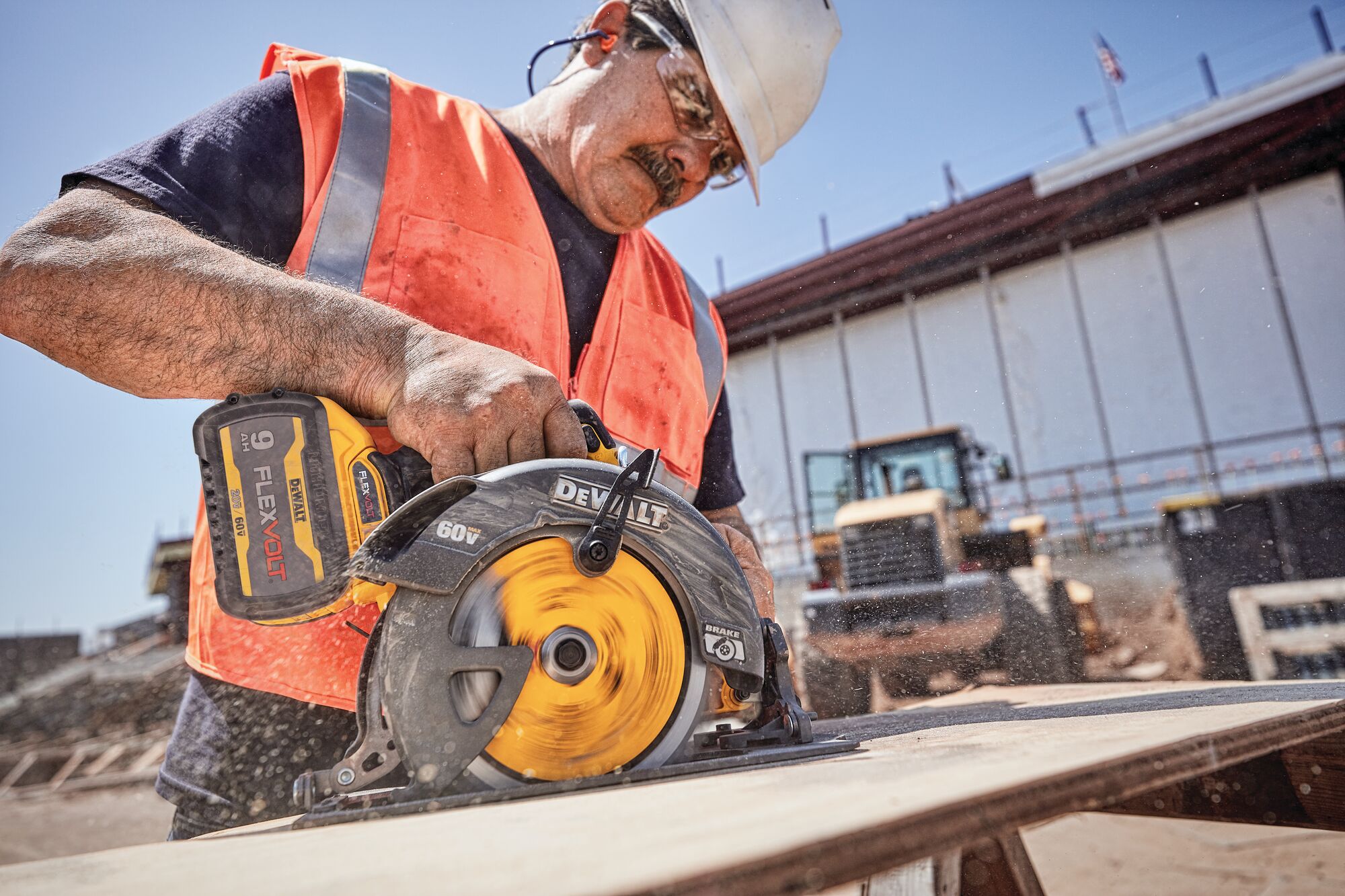 FLEXVOLT brushless cordless circular saw with brake kit being used by person on wood.