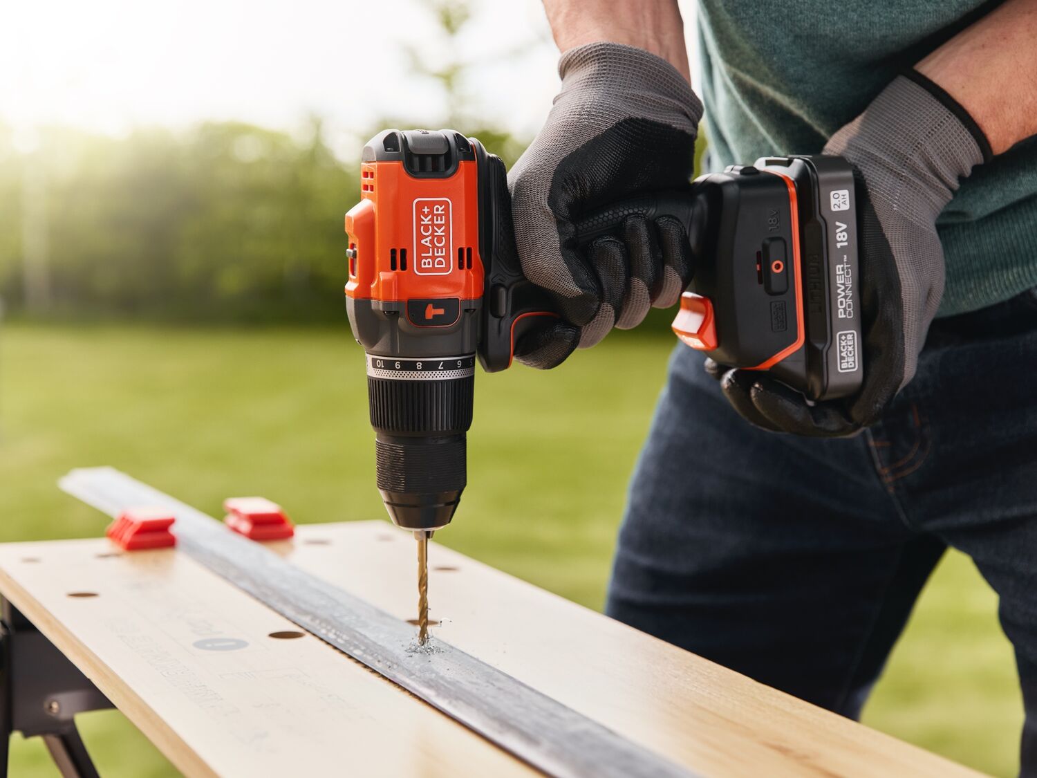 Metal being drilled into using the BLACK+DECKER® 18V POWERCONNECT™ Brushless Hammer Drill.