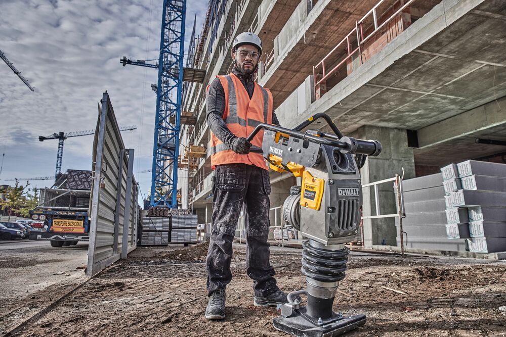 Worker preparing to use Powershift Rammer on a construction site