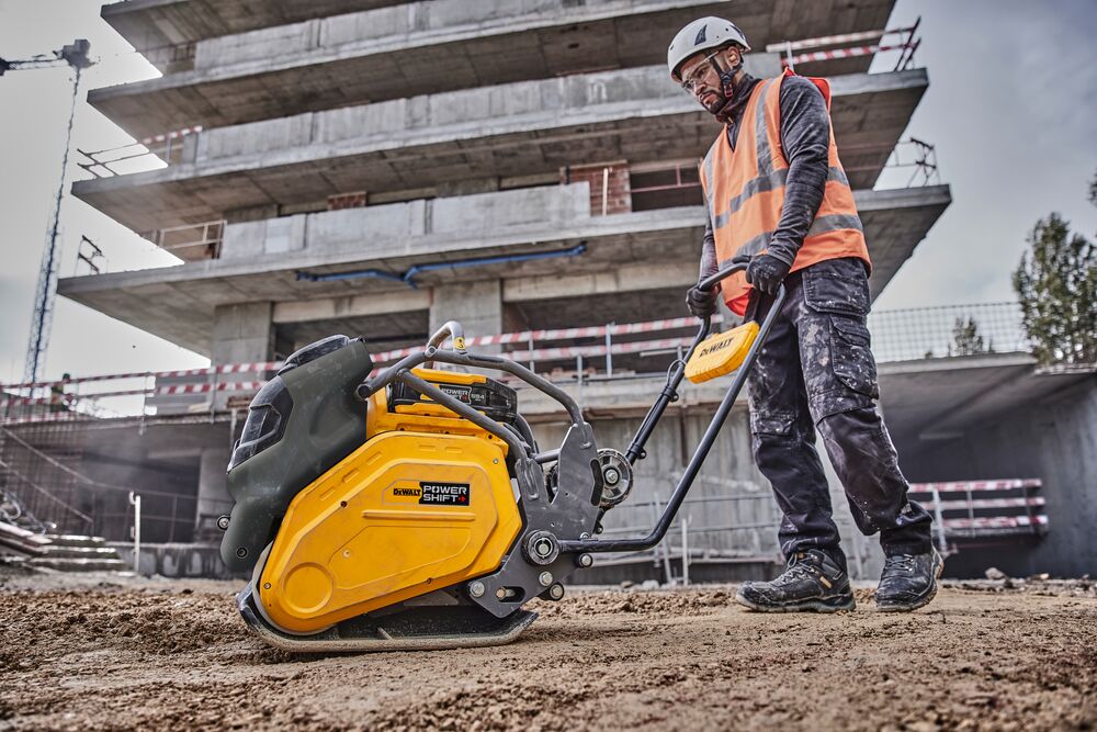 Construction worker uses Powershift Plate Compactor