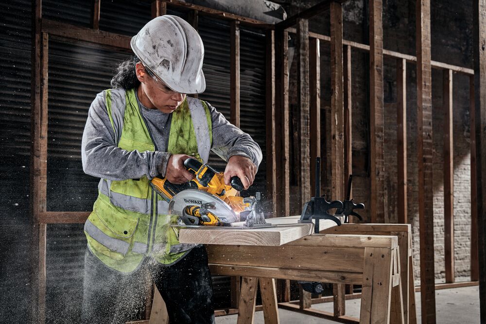 18V XR Brushless Circular Saw cutting wood on a work site