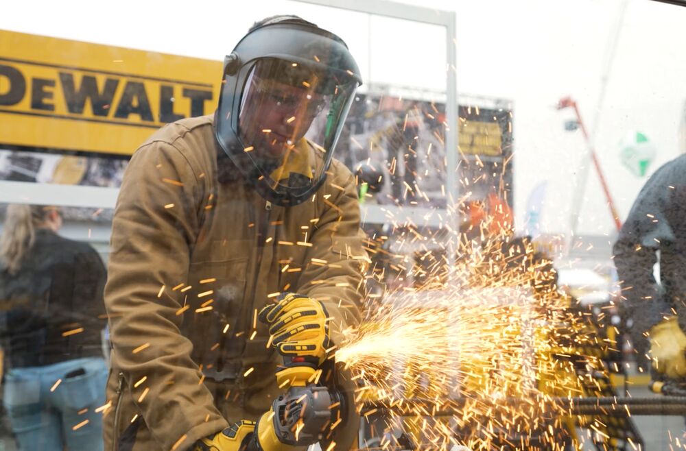 Image from World of Concrete of Construction Worker Using DEWALT® POWERSHIFT™ System