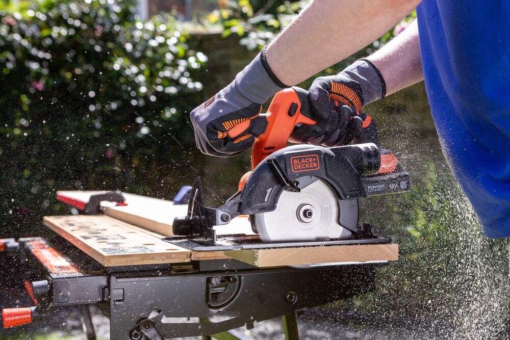 A wooden plank being cut with the BLACK+DECKER® 18V POWERCONNECT™ Cordless Circular Saw.