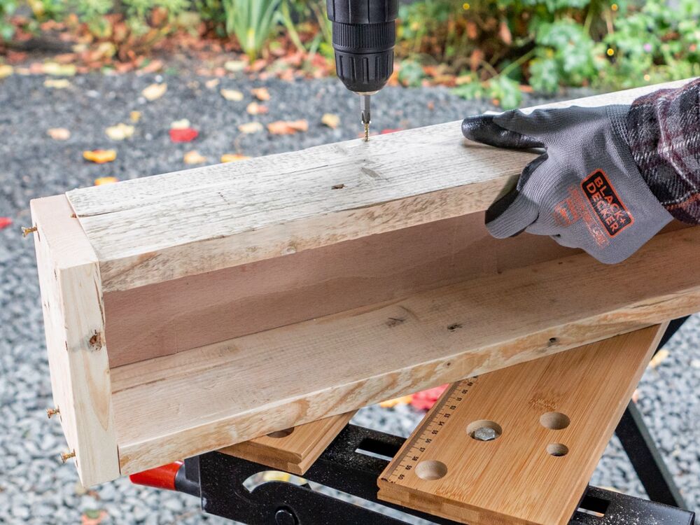 A wooden candle holder being assembled with the BLACK+DECKER POWERCONNECT  18V Cordless Drill Driver.