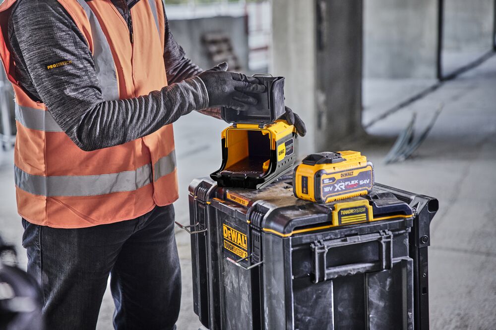 Construction worker opening Powershift Flexvolt Adaptor 