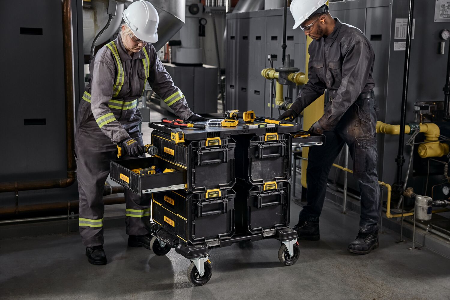 2 people working around a TOUGHSYSTEM 2.0 tower in an MRO enviornment