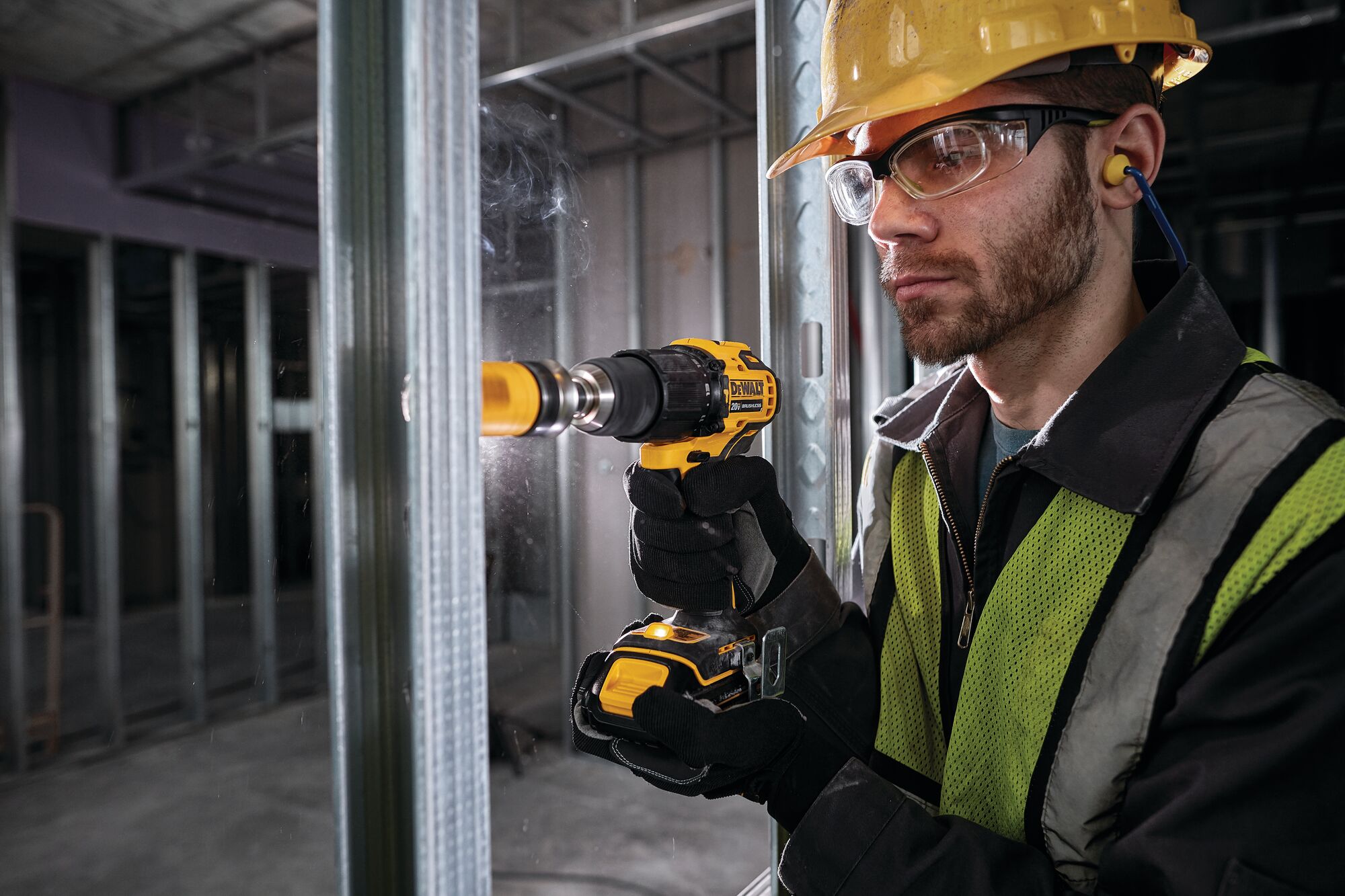 Atomic cordless compact half inch hammer drill driver being used by a person.